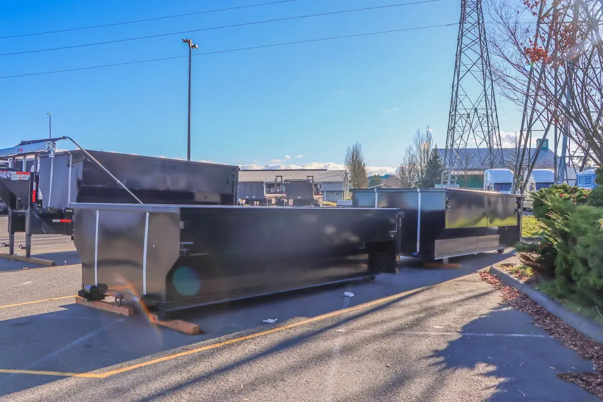 Roll-off dumpster ready for waste disposal at job site for Demolition Dumpster Rental in Mills River